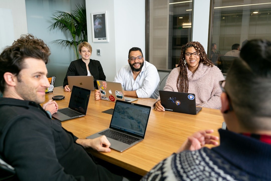 Leadership group reviewing decisions around a meeting table
