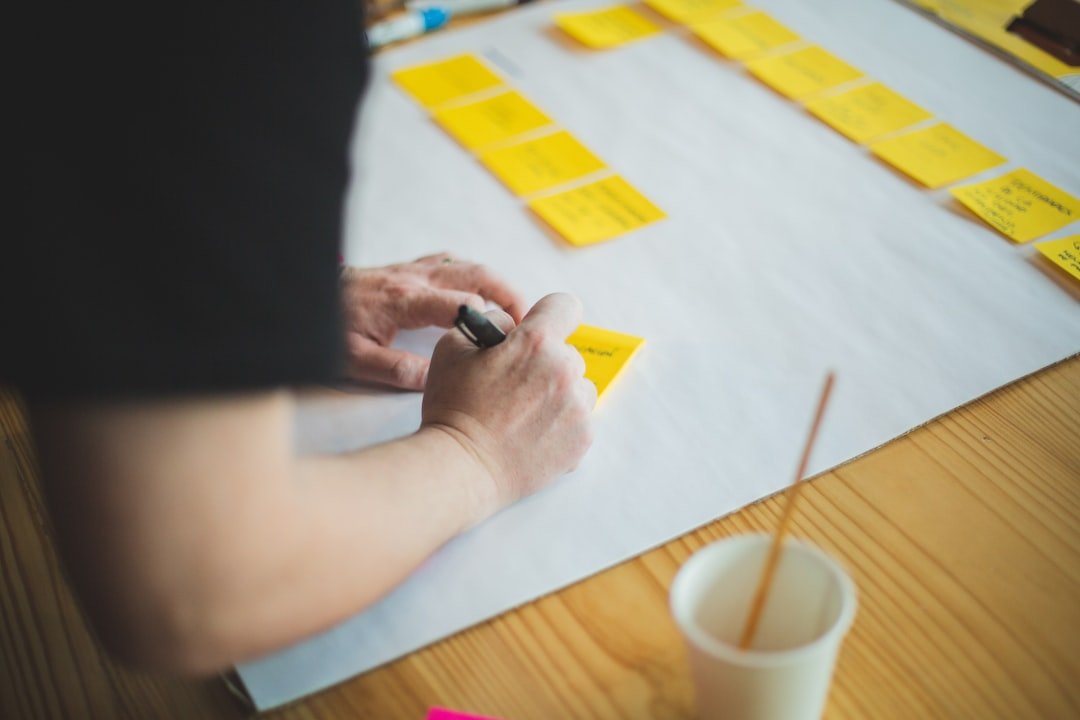 Positioning ideas arranged on notes at a worktable